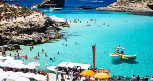 Best beaches in Malta aerial view of turquoise Mediterranean water and golden sand