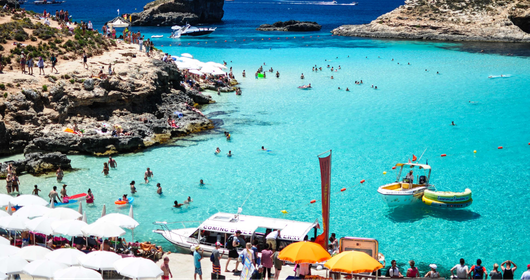 Best beaches in Malta aerial view of turquoise Mediterranean water and golden sand